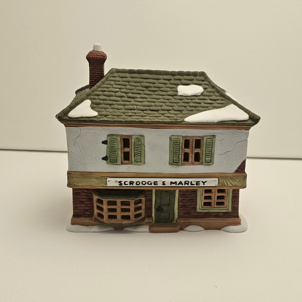 Festive Village House with Green Roof and Brown Walls